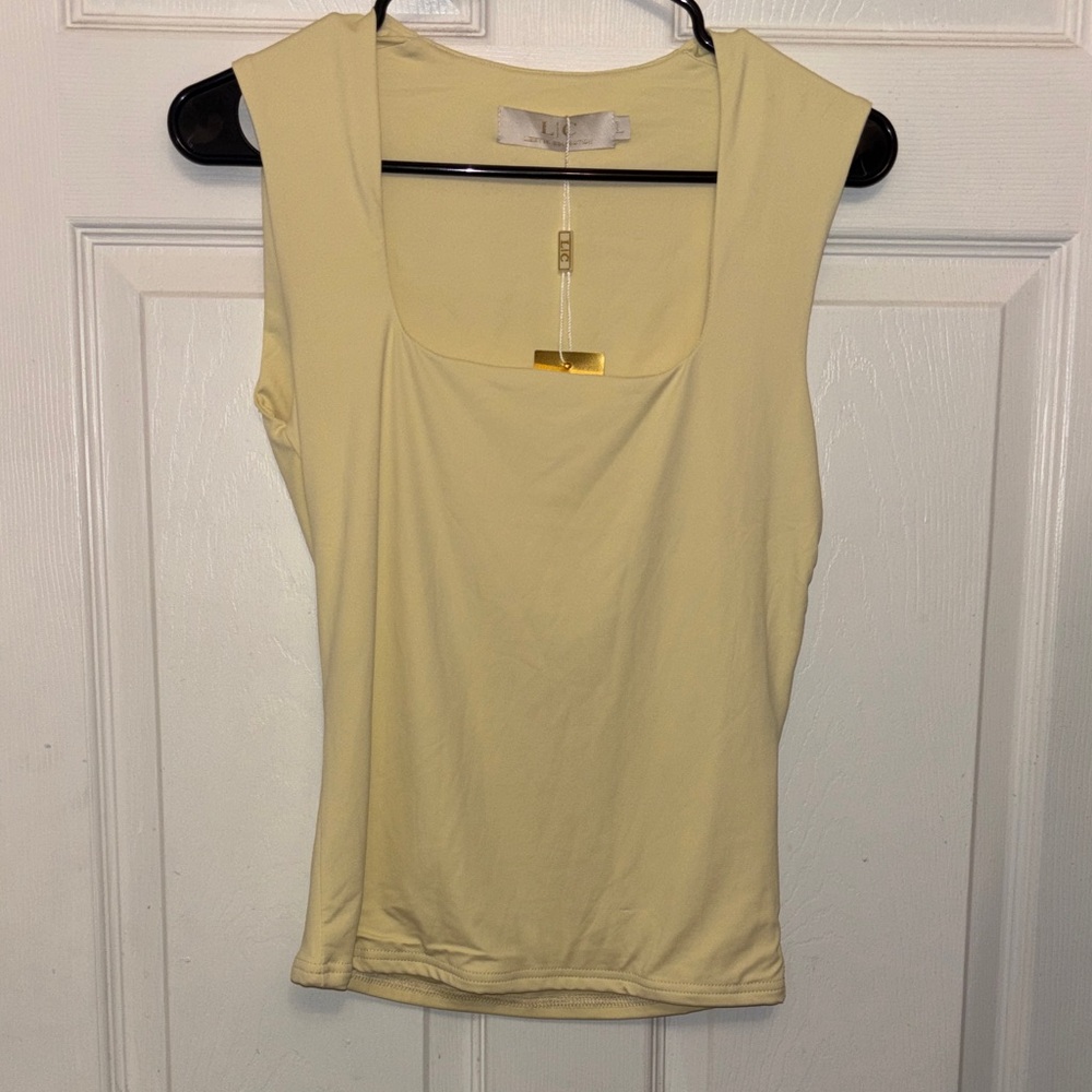 Chic Cream Sleeveless Blouse